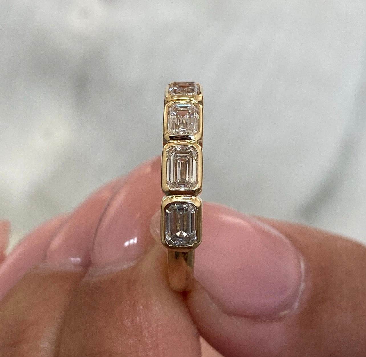 1.25ct Emerald East-West Bezel Set Ring