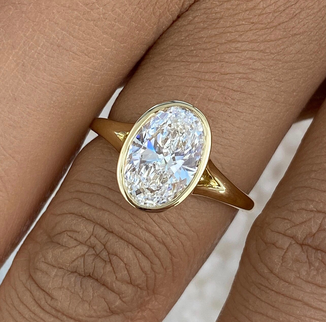 Oval Cut Bezel Set Proposal Ring